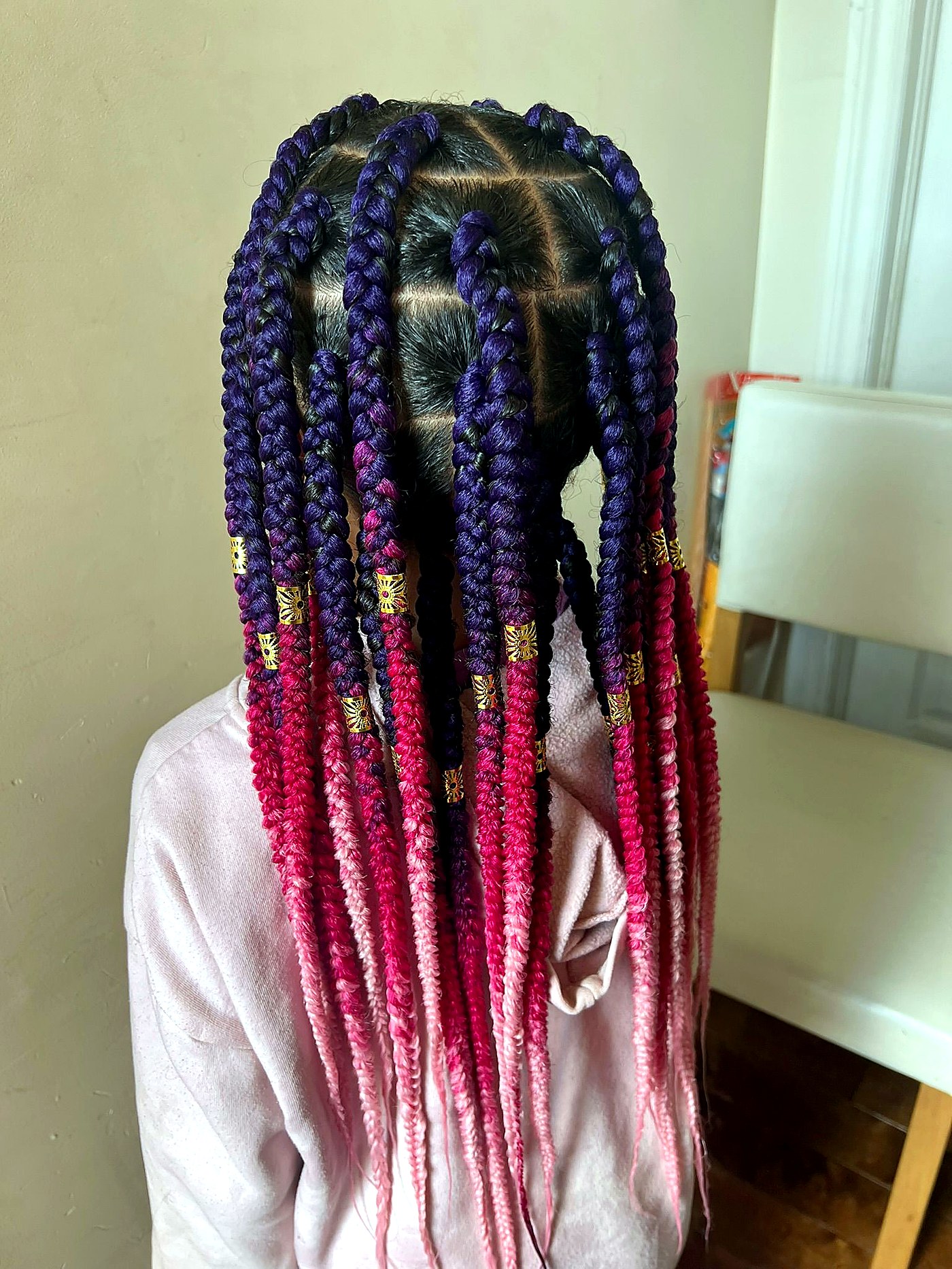 Beautiful braided hairstyle on Afro-American client
